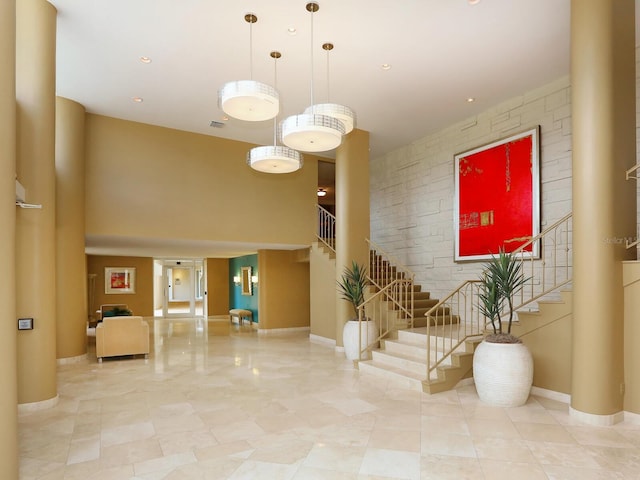 2295 Gulf Of Mexico Dr Unit 64S, Longboat Key, FL 34228 - common area with stairs and a towering ceiling