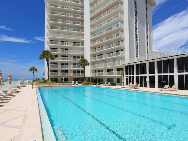 2295 Gulf Of Mexico Dr Unit 64S, Longboat Key, FL 34228 - community pool featuring a patio area
