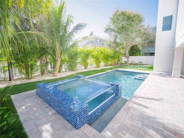 111 6th St N, Bradenton Beach, FL 34217 - view of pool with a fenced backyard, a patio area, and a pool with connected hot tub
