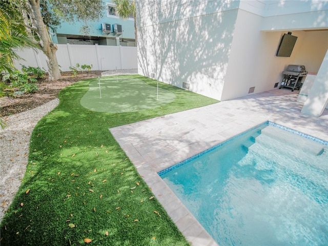 111 6th St N, Bradenton Beach, FL 34217 - view of swimming pool featuring a putting area and a patio area