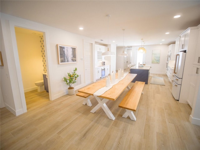 111 6th St N, Bradenton Beach, FL 34217 - dining space with light wood finished floors and recessed lighting