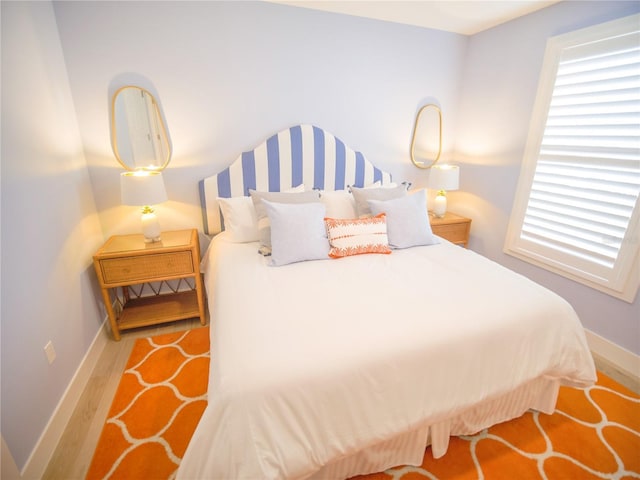 111 6th St N, Bradenton Beach, FL 34217 - bedroom with wood finished floors and multiple windows