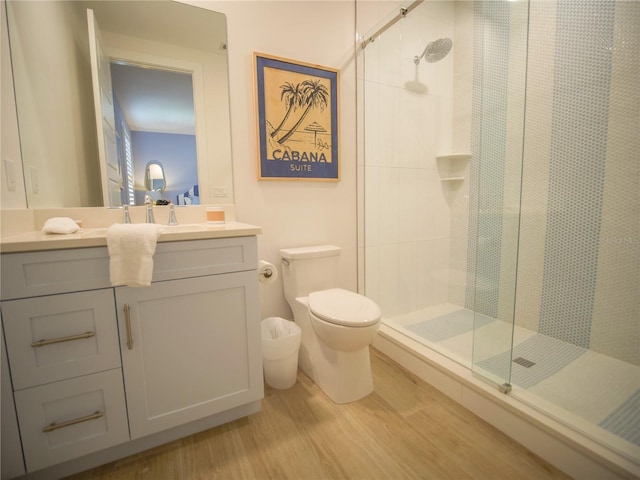 111 6th St N, Bradenton Beach, FL 34217 - bathroom with wood finished floors, a shower stall, and vanity