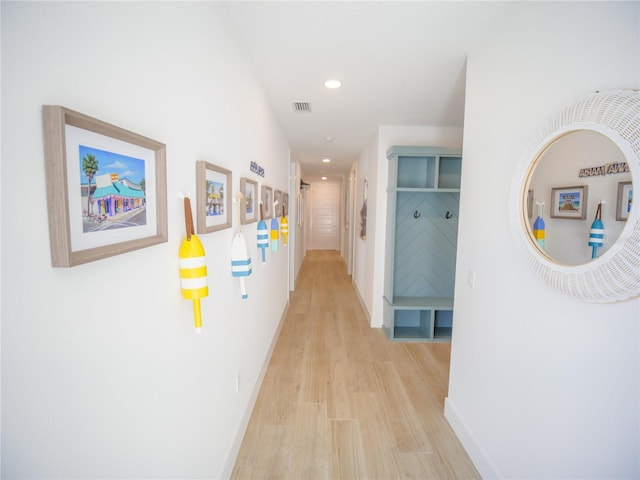 111 6th St N, Bradenton Beach, FL 34217 - corridor with light wood-style flooring and recessed lighting