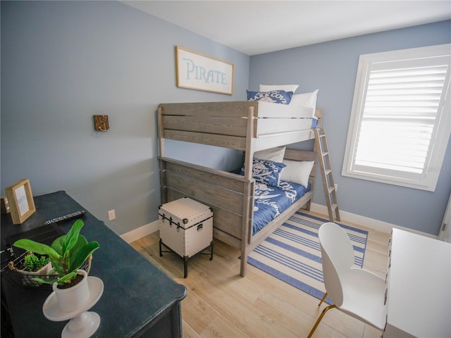 111 6th St N, Bradenton Beach, FL 34217 - bedroom featuring wood finished floors and baseboards