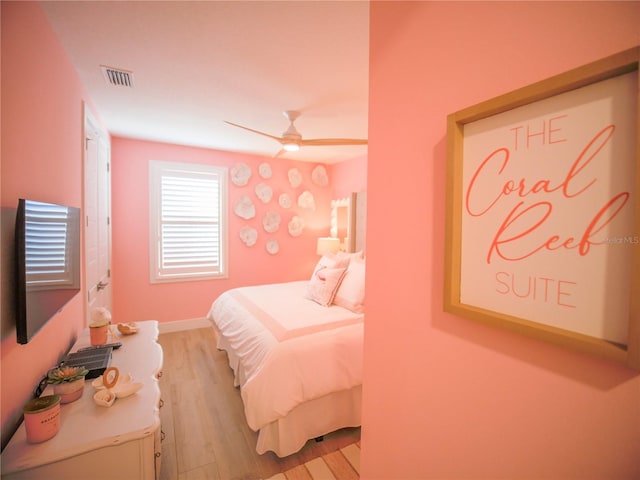 111 6th St N, Bradenton Beach, FL 34217 - bedroom with light wood finished floors and ceiling fan
