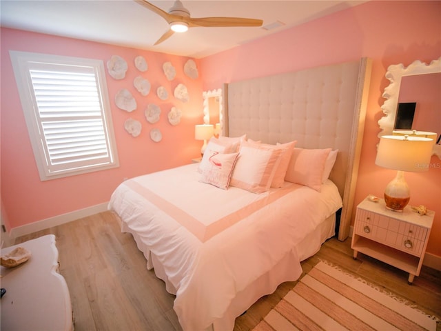 111 6th St N, Bradenton Beach, FL 34217 - bedroom featuring light wood-style flooring and a ceiling fan