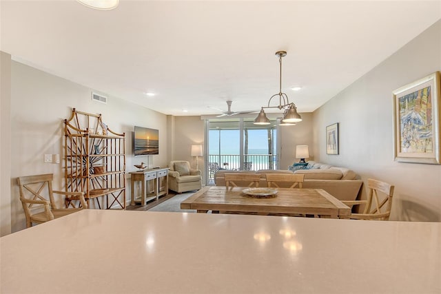 4325 Gulf Of Mexico Dr Unit 204, Longboat Key, FL 34228 - kitchen featuring open floor plan, a ceiling fan, and decorative light fixtures