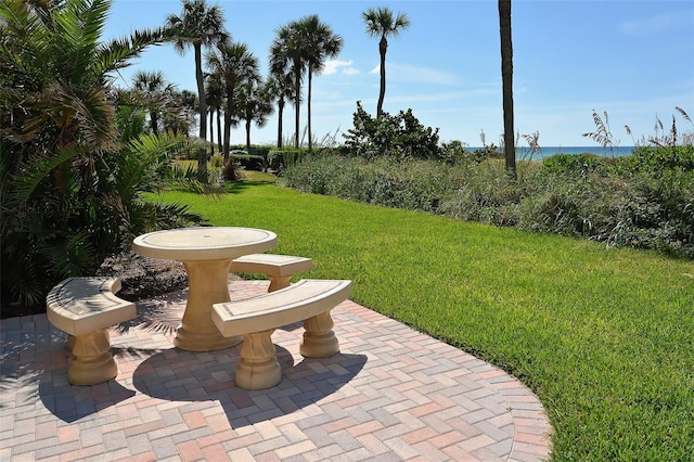 4325 Gulf Of Mexico Dr Unit 204, Longboat Key, FL 34228 - view of grassy yard featuring a patio and a water view