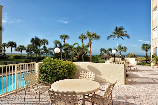 4325 Gulf Of Mexico Dr Unit 204, Longboat Key, FL 34228 - view of patio featuring an outdoor pool and outdoor dining space