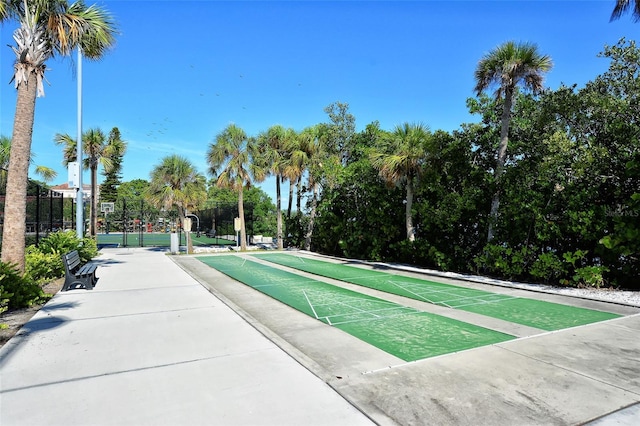 4325 Gulf Of Mexico Dr Unit 204, Longboat Key, FL 34228 - view of home's community featuring shuffleboard and view of wooded area