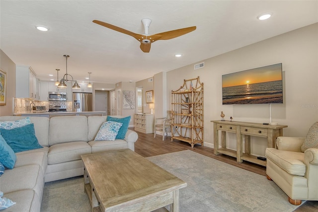4325 Gulf Of Mexico Dr Unit 204, Longboat Key, FL 34228 - living area with wood finished floors, recessed lighting, and a ceiling fan