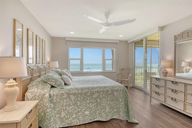 4325 Gulf Of Mexico Dr Unit 204, Longboat Key, FL 34228 - bedroom featuring access to exterior, wood finished floors, a water view, and ceiling fan