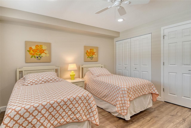 4325 Gulf Of Mexico Dr Unit 204, Longboat Key, FL 34228 - bedroom with a closet, wood finished floors, a ceiling fan, and recessed lighting