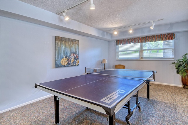 4325 Gulf Of Mexico Dr Unit 204, Longboat Key, FL 34228 - recreation room with rail lighting, carpet flooring, and a textured ceiling