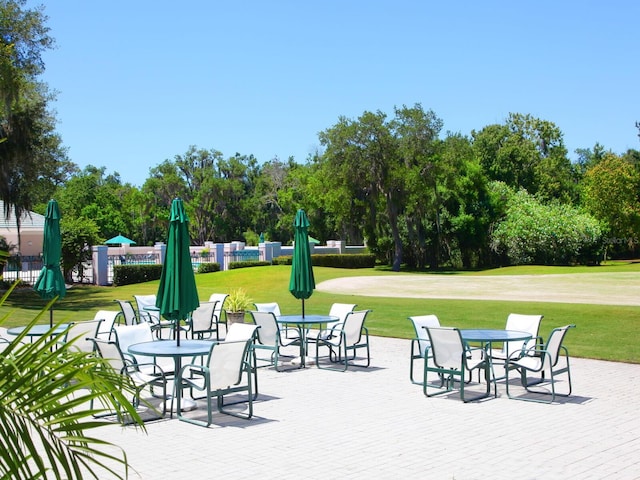 10120 Carnoustie Pl, Bradenton, FL 34211 - view of patio featuring view of scattered trees and outdoor dining space