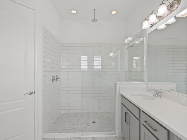 10120 Carnoustie Pl, Bradenton, FL 34211 - bathroom featuring tiled shower, vanity, and recessed lighting