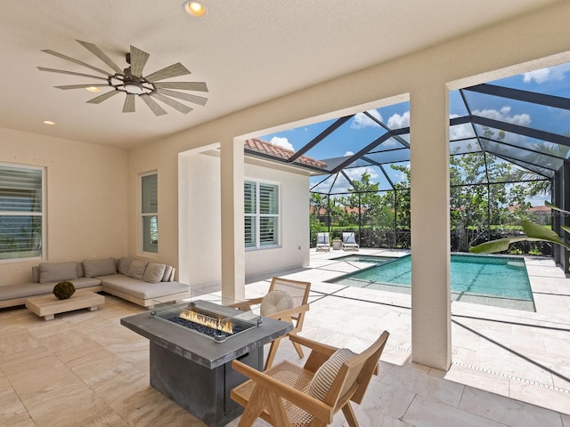 10120 Carnoustie Pl, Bradenton, FL 34211 - view of patio featuring an outdoor living space with a fire pit, an outdoor pool, ceiling fan, and a lanai