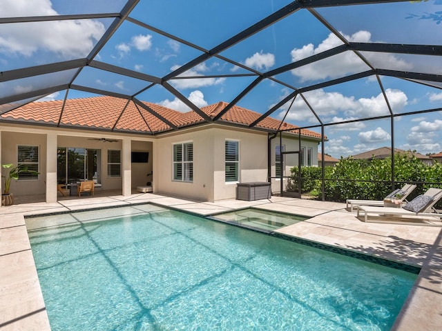 10120 Carnoustie Pl, Bradenton, FL 34211 - view of pool with a ceiling fan, a patio area, glass enclosure, and a pool with connected hot tub