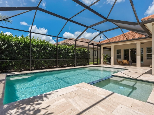 10120 Carnoustie Pl, Bradenton, FL 34211 - view of pool featuring a patio, a pool with connected hot tub, and a lanai