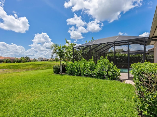 10120 Carnoustie Pl, Bradenton, FL 34211 - view of grassy yard with a lanai