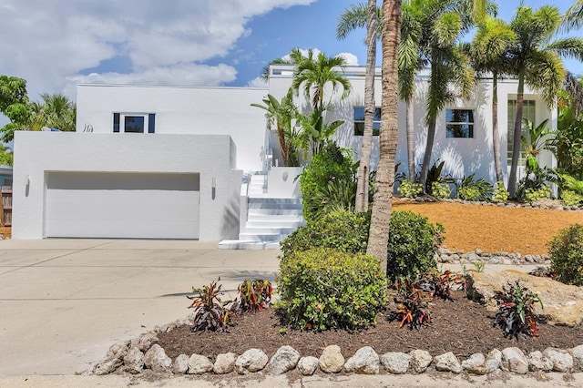1168 Westway Dr, Sarasota, FL 34236 - view of front of property with stucco siding, driveway, and an attached garage