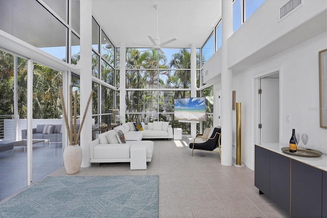 1168 Westway Dr, Sarasota, FL 34236 - sunroom with a towering ceiling, expansive windows, and tile patterned floors