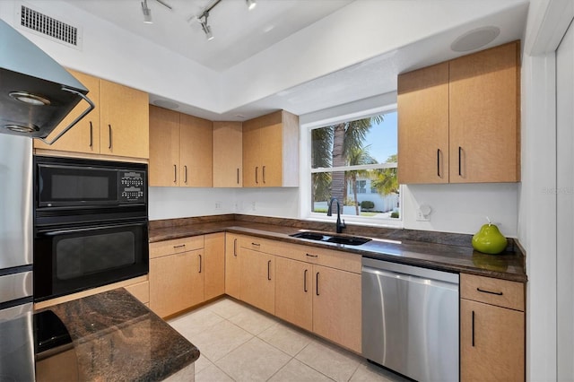 1168 Westway Dr, Sarasota, FL 34236 - kitchen featuring black appliances, ventilation hood, light tile patterned floors, light brown cabinetry, and track lighting