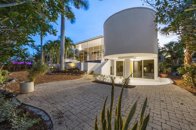 1168 Westway Dr, Sarasota, FL 34236 - view of patio / terrace featuring a sunroom and stairs
