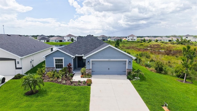 6435 165th Dr E, Parrish, FL 34219 - view of front of house with stone siding, a garage, a residential view, and a front lawn