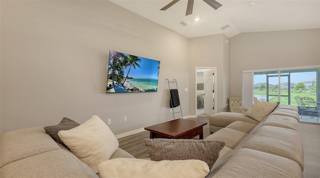 6435 165th Dr E, Parrish, FL 34219 - living room with high vaulted ceiling, a ceiling fan, and wood finished floors