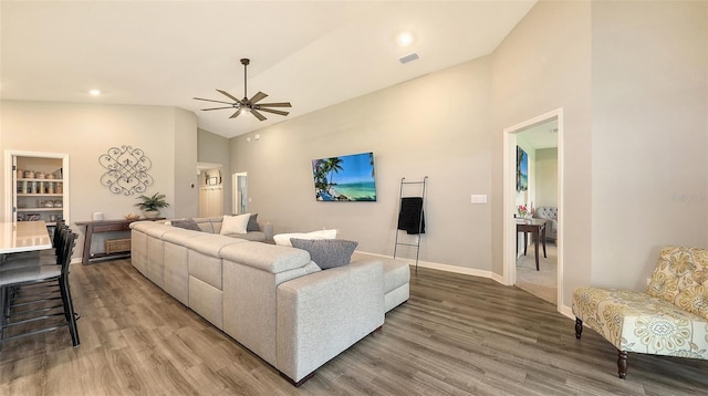 6435 165th Dr E, Parrish, FL 34219 - living area with light wood-style flooring, ceiling fan, high vaulted ceiling, and recessed lighting