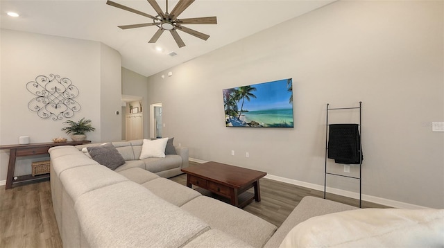 6435 165th Dr E, Parrish, FL 34219 - living area featuring wood finished floors, a ceiling fan, high vaulted ceiling, and recessed lighting