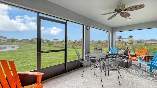 6435 165th Dr E, Parrish, FL 34219 - sunroom / solarium featuring ceiling fan, outdoor dining area, and a water view