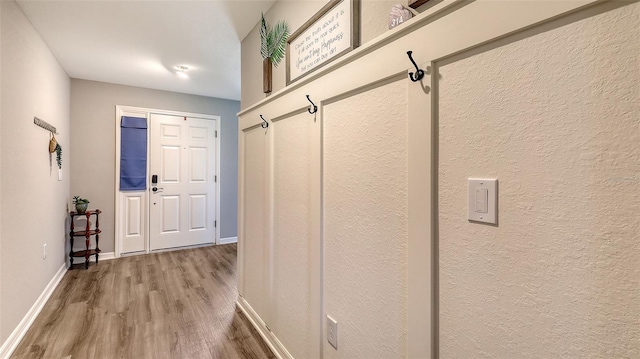 6435 165th Dr E, Parrish, FL 34219 - mudroom featuring wood finished floors and baseboards