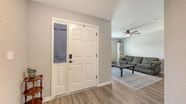6435 165th Dr E, Parrish, FL 34219 - foyer entrance with wood finished floors and a ceiling fan