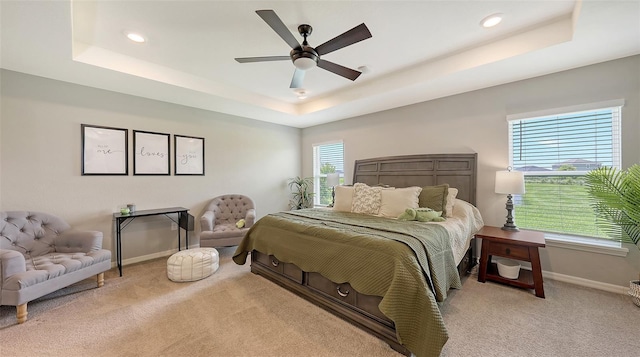 6435 165th Dr E, Parrish, FL 34219 - bedroom featuring a tray ceiling, light colored carpet, recessed lighting, and a ceiling fan