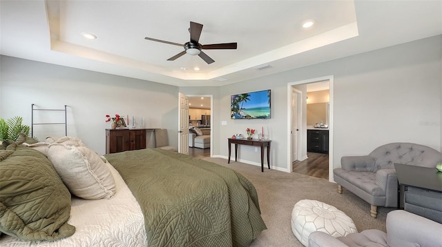 6435 165th Dr E, Parrish, FL 34219 - bedroom with a raised ceiling, recessed lighting, carpet flooring, ceiling fan, and ensuite bath