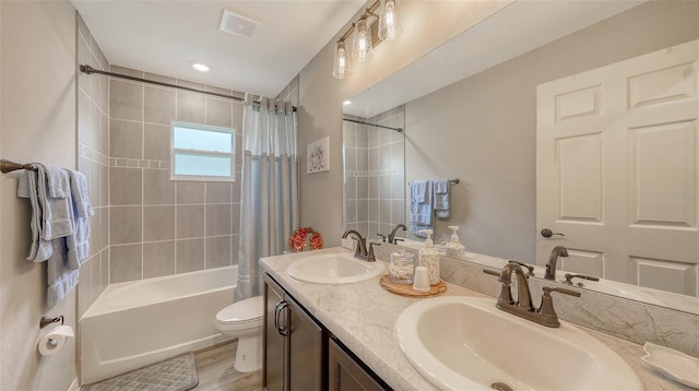 6435 165th Dr E, Parrish, FL 34219 - full bathroom with shower / bath combo, double vanity, and wood finished floors