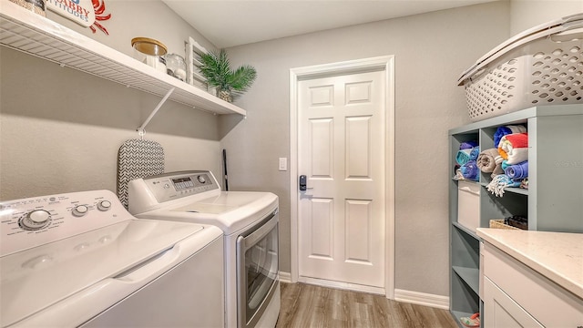 6435 165th Dr E, Parrish, FL 34219 - laundry area with washer and clothes dryer and light wood finished floors