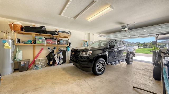 6435 165th Dr E, Parrish, FL 34219 - garage with water heater, a garage door opener, and concrete block wall