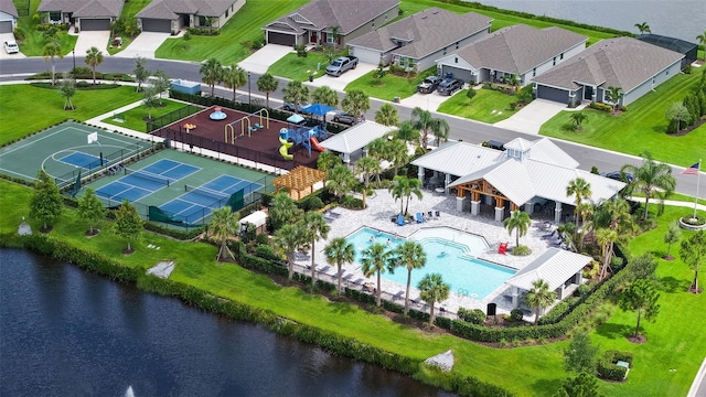 6435 165th Dr E, Parrish, FL 34219 - aerial view of residential area featuring a pool area and a nearby body of water