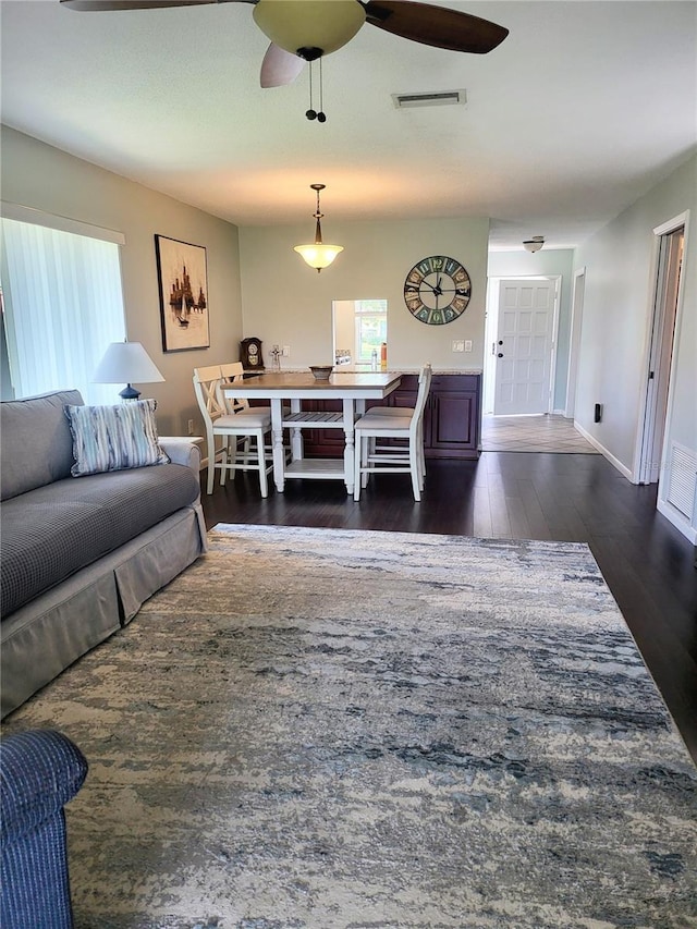 3305 Notre Dame Pl Unit 3305, Bradenton, FL 34207 - living room with dark wood-type flooring and ceiling fan