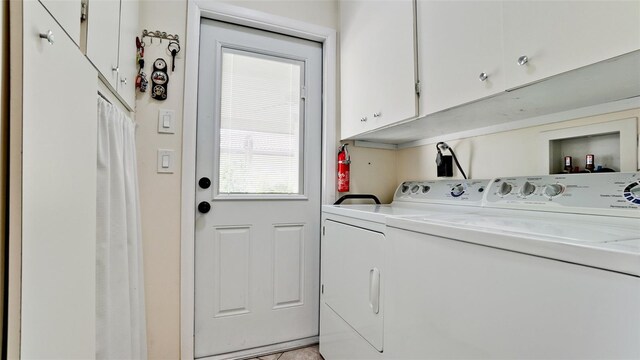 3305 Notre Dame Pl Unit 3305, Bradenton, FL 34207 - laundry room with cabinet space and washer and dryer