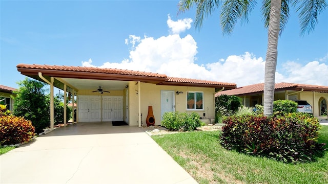 3305 Notre Dame Pl Unit 3305, Bradenton, FL 34207 - mediterranean / spanish-style home featuring driveway, stucco siding, a carport, and a tiled roof