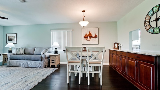 3305 Notre Dame Pl Unit 3305, Bradenton, FL 34207 - dining room with dark wood-style floors and baseboards