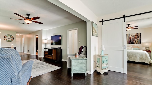 3305 Notre Dame Pl Unit 3305, Bradenton, FL 34207 - living room featuring a ceiling fan, wood finished floors, and a barn door