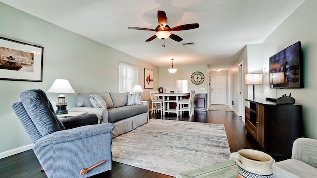3305 Notre Dame Pl Unit 3305, Bradenton, FL 34207 - living room with a ceiling fan and dark wood-style flooring