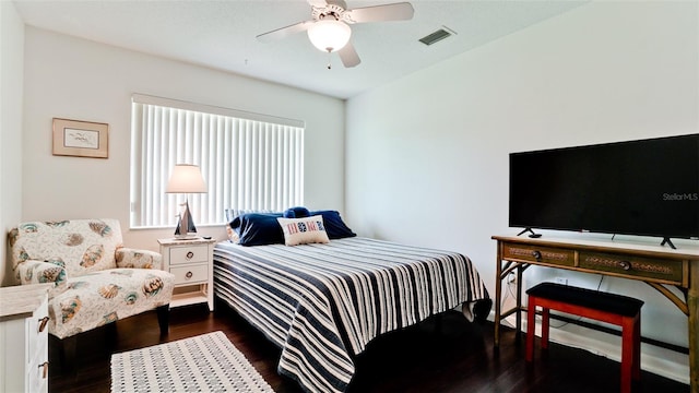 3305 Notre Dame Pl Unit 3305, Bradenton, FL 34207 - bedroom with dark wood-style flooring and ceiling fan