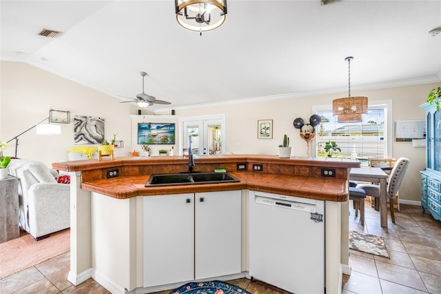 6178 Coliseum Blvd, Port Charlotte, FL 33981 - kitchen featuring dishwasher, open floor plan, tile countertops, white cabinetry, and light tile patterned flooring